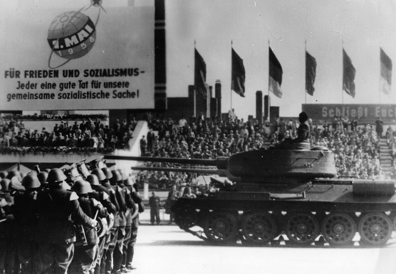 May 1950:  The People's Army with a Russian T-34  tank parading in East Berlin at a May Day military parade.  (Photo by Keystone/Getty Images)