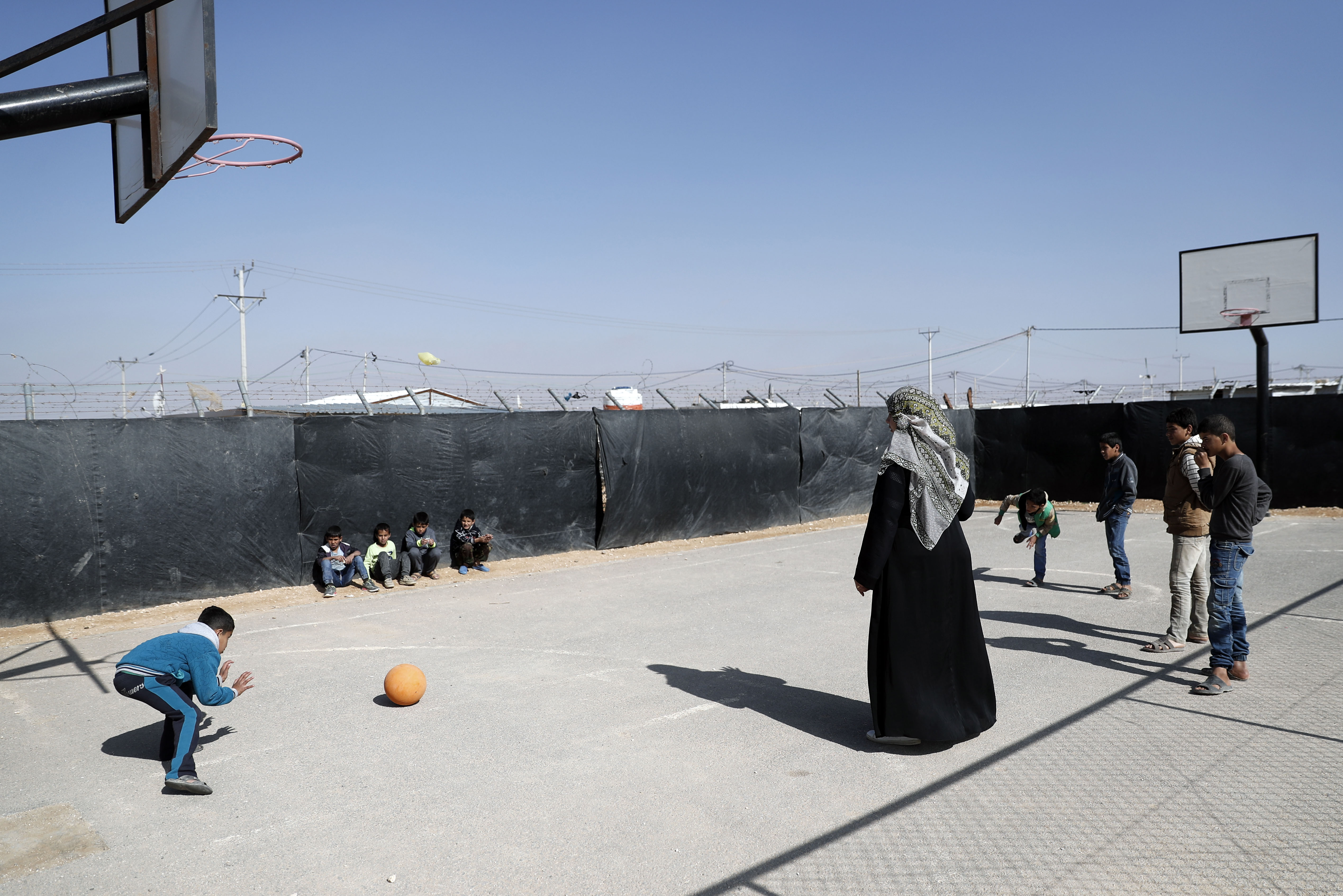 Syrian refugees play with a ball at the Zaatari AFP PHOTO / THOMAS COEX