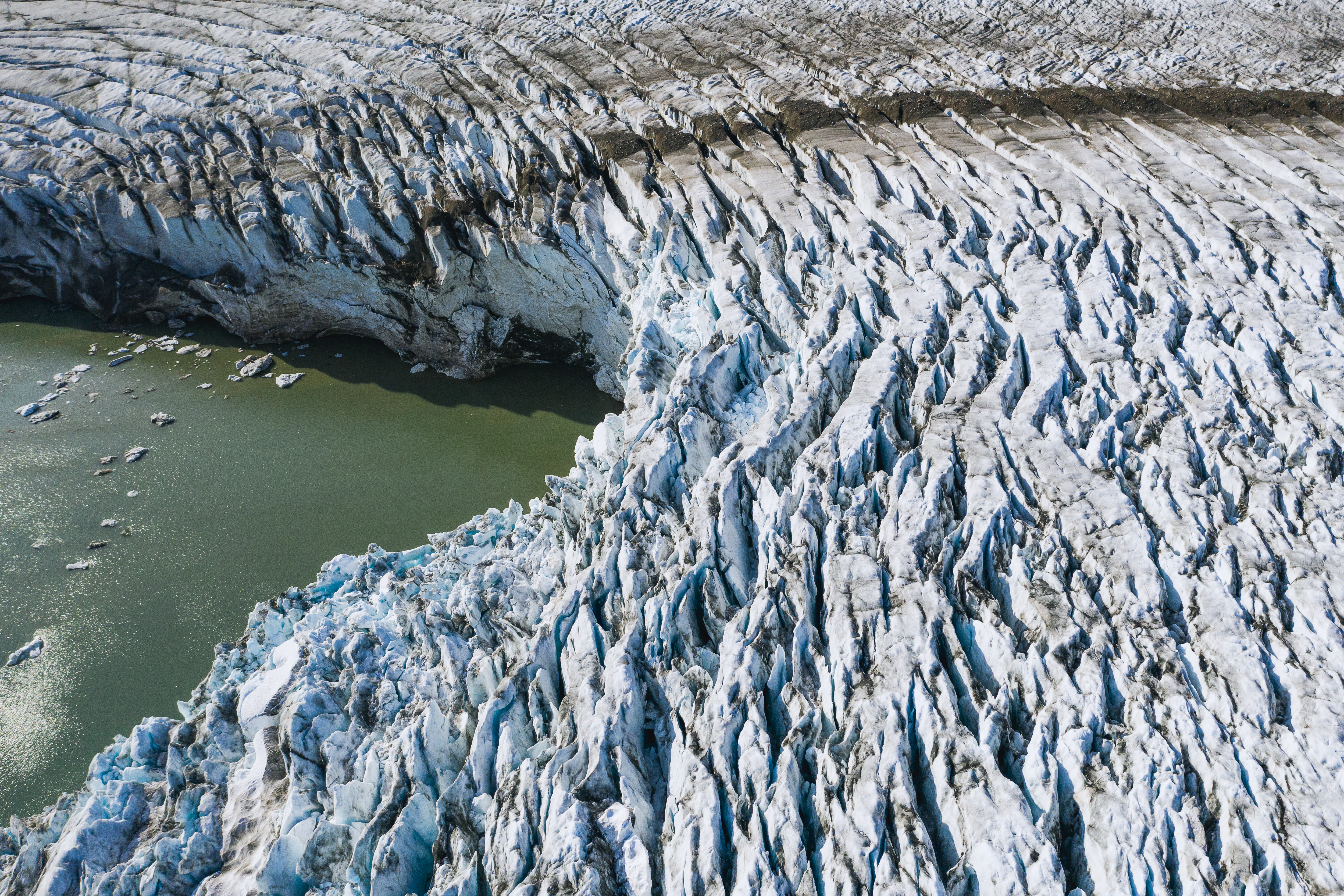 An aerial photo taken on August 17, 2019 shows a view of the Apusiajik glacier, near Kulusuk (aslo spelled Qulusuk), a settlement in the Sermersooq municipality located on the island of the same name on the southeastern shore of Greenland. (Photo by Jonathan NACKSTRAND / AFP)