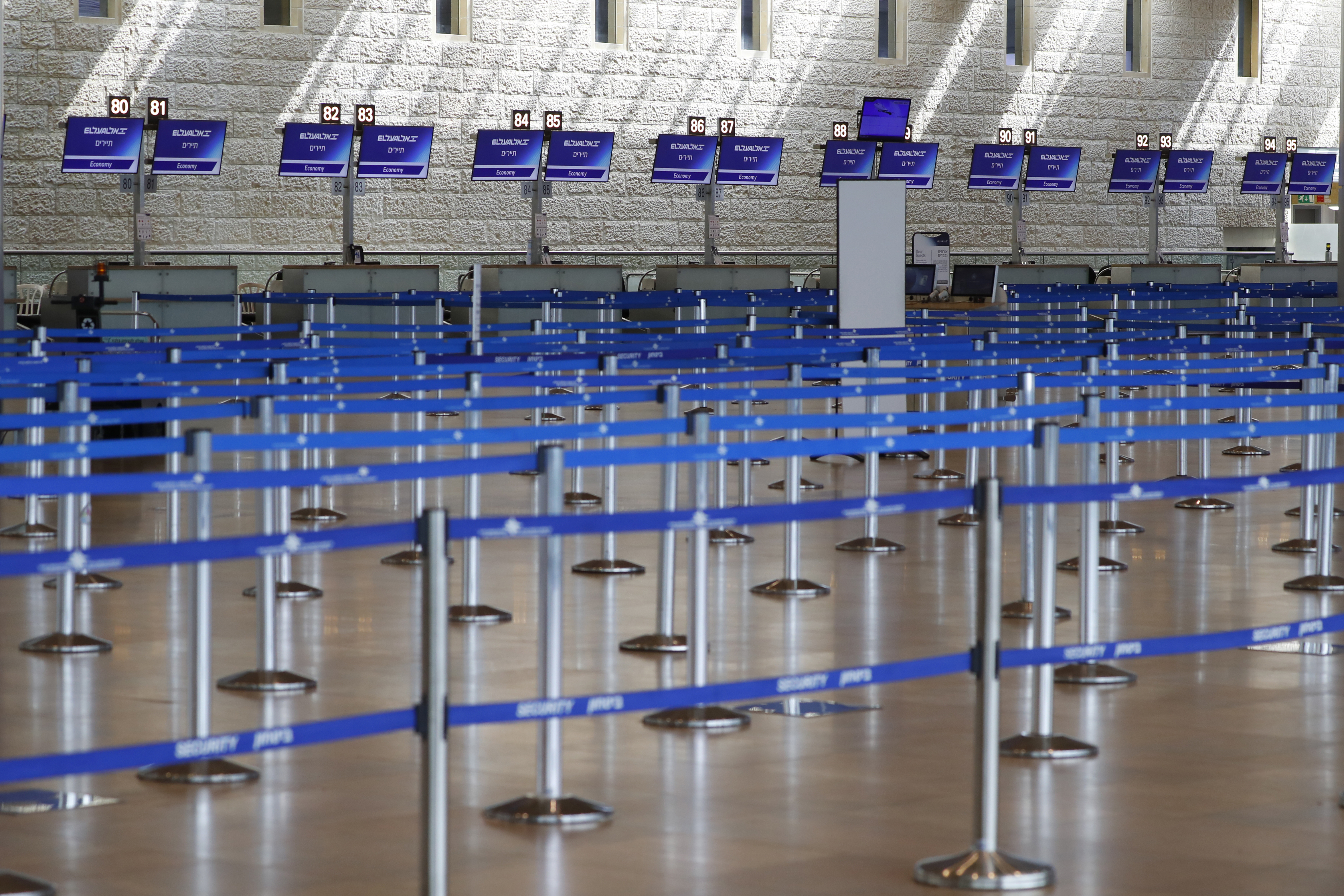 Check-in counters are empty at Ben Gurion International Airport near Tel Aviv, on March 10, 2020 amid major restrictions on travellers from several countries. - Israel imposed a two-week quarantine on all travellers entering the country, Prime Minister Benjamin Netanyahu said, toughening already significant travel restrictions. (Photo by JACK GUEZ / AFP)
