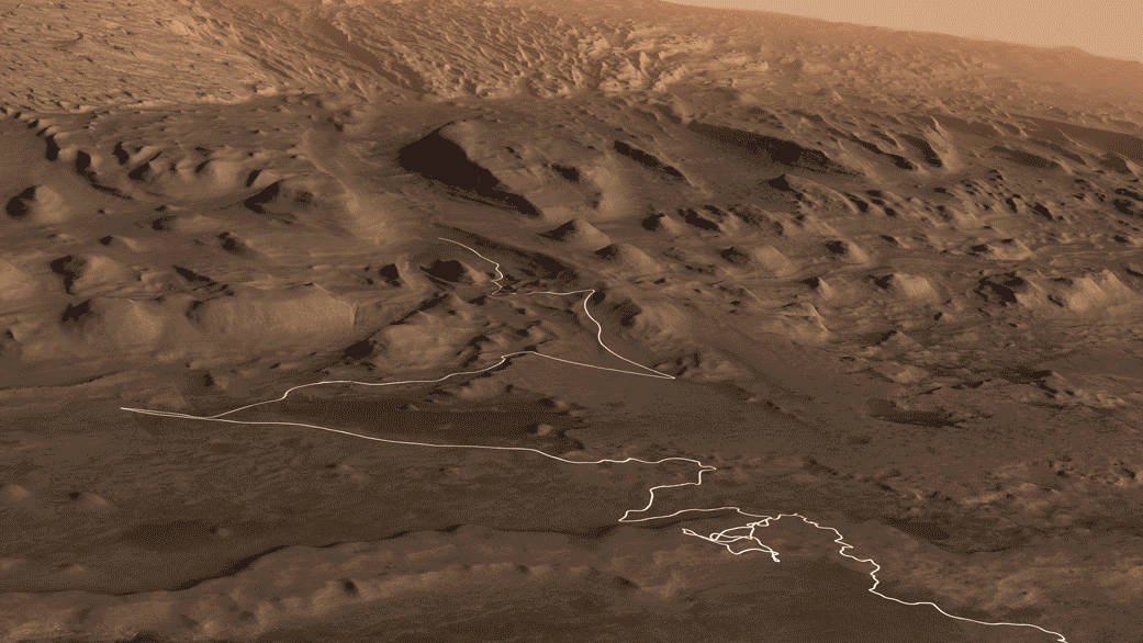 A Curiosity jövőbeli útvonalát fehér csíkkal illusztráló GIF-en a különböző rétegek (zölddel az agyagos, sárgával a szulfátos), valamint a Gediz Vallis folyóvölgy látható.