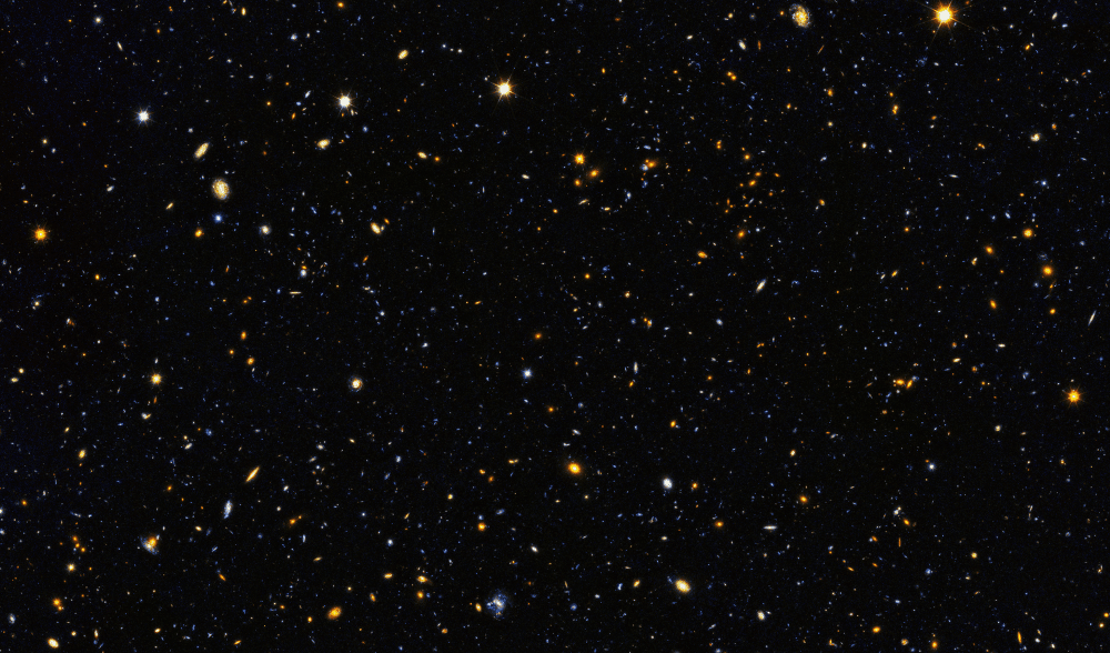 A Hubble űrtávcső "ultra mély ég" felvételének részlete 10 ezernél is több galaxist tartalmaz, köztük olyanokat, melyek 13 milliárd éve, az univerzum hajnalán jöttek létre